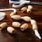 12 Packs: 12 ct. (144 total) Natural Wood Oval Beads, 32mm by Loops & Threads®